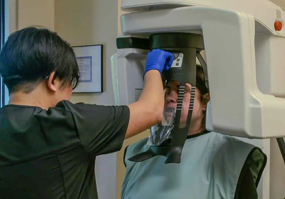 A patient having a panoramic x-ray taken during her appointment